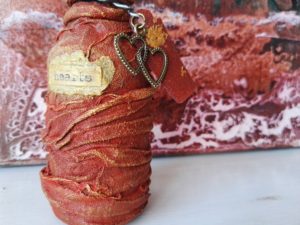 Small red bottle of hearts