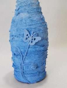 Add embellishments to bottle